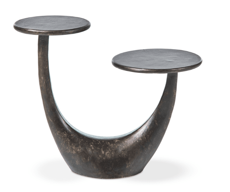 A dark-colored, metallic end table with a sculptural, U-shaped base supporting two circular tabletops at different heights. The surface has a textured, weathered finish. — 3D model