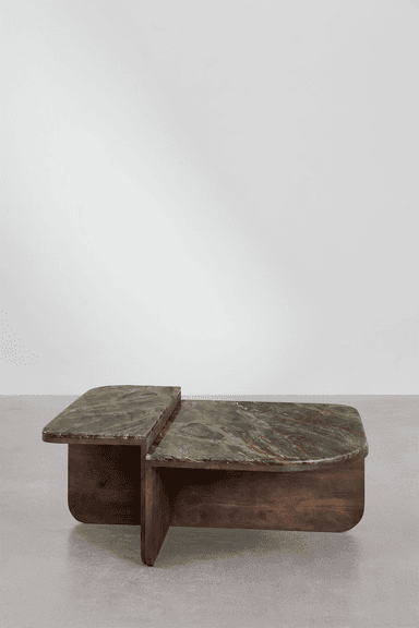 A two-tiered coffee table featuring rounded rectangular tops made of green marble with distinct reddish-brown and darker green veining. The base is constructed from dark, possibly stained wood or plywood, forming intersecting planes that support the two marble surfaces at staggered heights. The design exhibits a clean, sculptural aesthetic with smooth, curved edges throughout, presenting a substantial yet refined appearance. — 3D model
