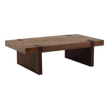 A rectangular, low-profile coffee table made of solid wood, featuring a thick tabletop and two substantial block-style legs, with visible dark metal or leather-like accents securing the top to the legs. The legs have a subtle textured finish. — 3D model