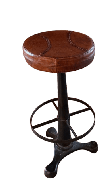 A tall, backless seating unit featuring a round, brown leather upholstered seat with decorative baseball-style stitching. The stool is supported by a dark-finished, possibly cast iron or steel, industrial-style base that includes a central column, a circular footrest, and a sturdy three-legged pedestal base. — 3D model