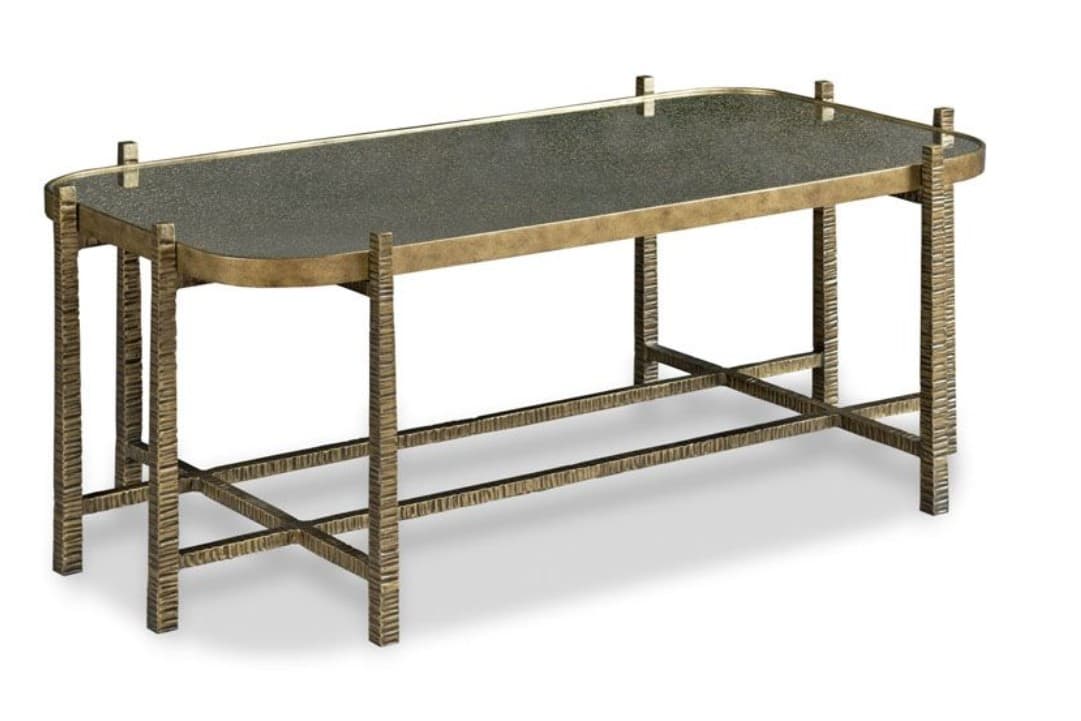 A rectangular coffee table featuring a dark, opaque glass top set within a slender brass frame. The table stands on four legs crafted from textured, aged brass, connected by lower cross-bracing for stability. The overall design suggests a blend of modern and classic aesthetics with a focus on material texture. — 3D model