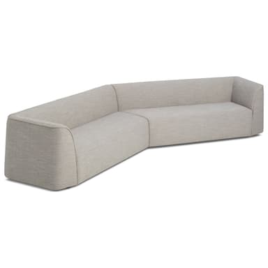 A sectional sofa with a rounded armrest on the left and a chaise lounge extending to the right. The upholstery is a textured brown fabric, and it sits on a light-colored wooden base. The sofa features plush cushioning. — 3D model