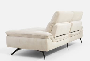 A contemporary sectional sofa with a chaise lounge extension. The sofa features plush, upholstered cushions with a textured fabric. The back cushions have horizontal stitching, and the seat cushions have a tufted grid pattern. It is supported by slender, angled black metal legs. — 3D model