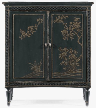 A dark green cabinet with two doors, featuring ornate gold-colored chinoiserie-style painted motifs of branches, flowers, and foliage. The cabinet has decorative trim around the top and bottom edges, and intricate patterned borders on the sides. It stands on four turned legs. The doors are fitted with two silver-toned drawer pulls. The finish appears distressed, suggesting an antique or vintage aesthetic. — 3D model