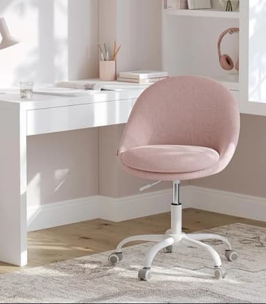 A modern desk chair featuring a rounded, barrel-style seat and backrest, upholstered in a light pink woven fabric. It stands on a white five-star base equipped with grey casters, allowing for mobility. A lever for height adjustment is visible beneath the seat, indicating swivel and pneumatic lift functionality. The design is sleek and minimalist, emphasizing comfort and functionality for a workspace. — 3D model