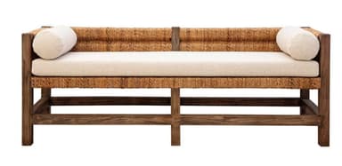A modern bench featuring a dark stained wooden frame, integrated side and back panels made from tightly woven natural fibers (resembling jute or rattan), and a removable off-white upholstered seat cushion. It is accessorized with two matching cylindrical bolster pillows. The design is contemporary with organic and natural material influences. — 3D model