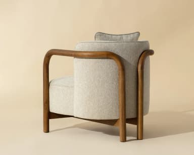 A single armchair with a wooden frame and upholstered seat, back, and armrests. It features a square-shaped seat cushion and a separate lumbar pillow. The wooden frame is visible as curved arms and legs, forming a distinct silhouette. — 3D model
