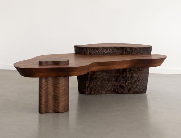A sculptural, multi-tiered coffee table made from dark wood with an organic, irregular shape. — 3D model