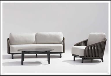 A contemporary two-seater sofa designed for outdoor use, featuring a robust black metal frame with slender, tapered legs. The backrest and armrests are crafted from dark grey woven synthetic rope, creating an open, slatted pattern that adds visual texture. The sofa includes two thick, off-white upholstered seat cushions and two matching back cushions, providing comfortable seating. Its design emphasizes clean lines and modern aesthetics, suitable for various exterior settings. — 3D model