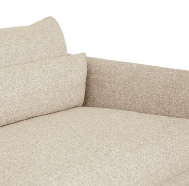 A close-up view of an upholstered sofa section, characterized by its light beige, textured fabric. The image shows a seat cushion, a plush back cushion, and a low, wide armrest, suggesting a comfortable and modern design. The fabric has a subtle woven pattern, giving it depth and visual interest. — 3D model