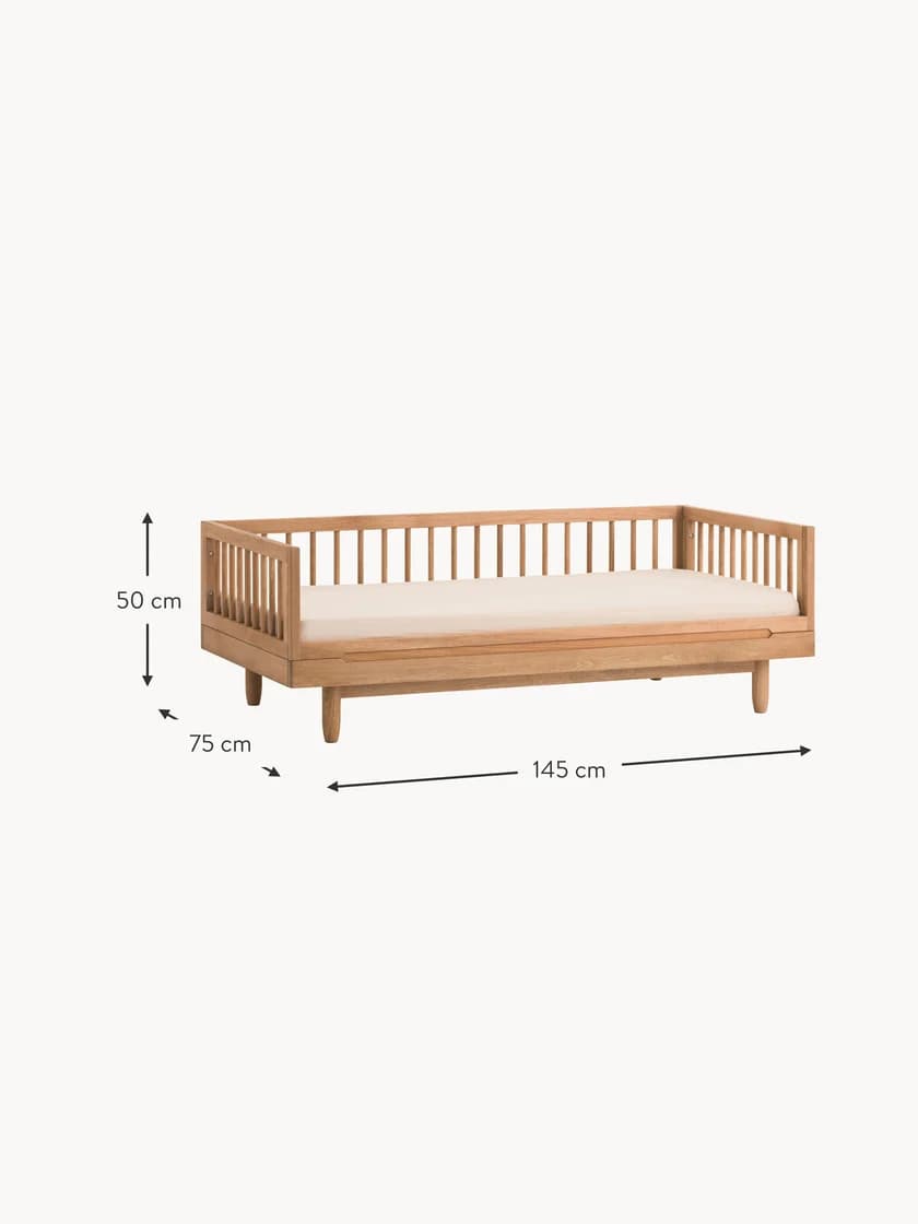 A minimalist daybed constructed from light-toned wood, featuring slatted sides on three edges and supported by four tapered, round legs. It includes a light-colored, upholstered mattress, suggesting a contemporary or Scandinavian aesthetic. The design is clean and uncluttered, suitable for various interior styles. — 3D model
