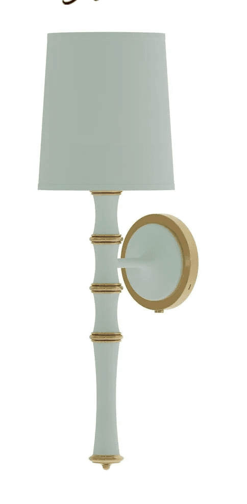 A decorative wall sconce featuring a tapered fabric shade and a bamboo-inspired stem, finished in a light mint green with polished gold accents. — 3D model