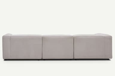 A contemporary light beige modular sectional sofa with an L-shaped configuration, featuring a chaise lounge extension, low-profile design, and block arms. — 3D model
