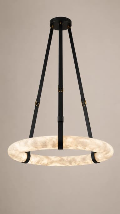 A modern circular pendant light featuring a large, illuminated off-white ring suspended by three black straps with brass-colored buckles from a black ceiling canopy. — 3D model