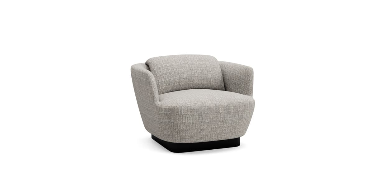 A modern armchair with a rounded, barrel-shaped silhouette. It features a high back that curves into integrated armrests, creating a cohesive form. A separate, plush back cushion is positioned against the main backrest for added comfort. The armchair is upholstered in a textured, light gray fabric and rests on a dark, squared base that appears to be made of a solid material, possibly wood or metal. — 3D model