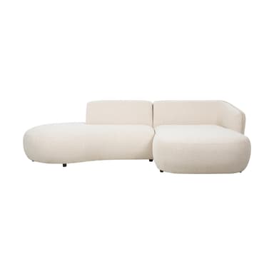 A modular sectional sofa with a curved, organic design. It features a plush, textured upholstery in a light cream or off-white color and sits on small, dark metal legs. The sofa appears to be composed of at least two sections, one with an extended chaise lounge. — 3D model