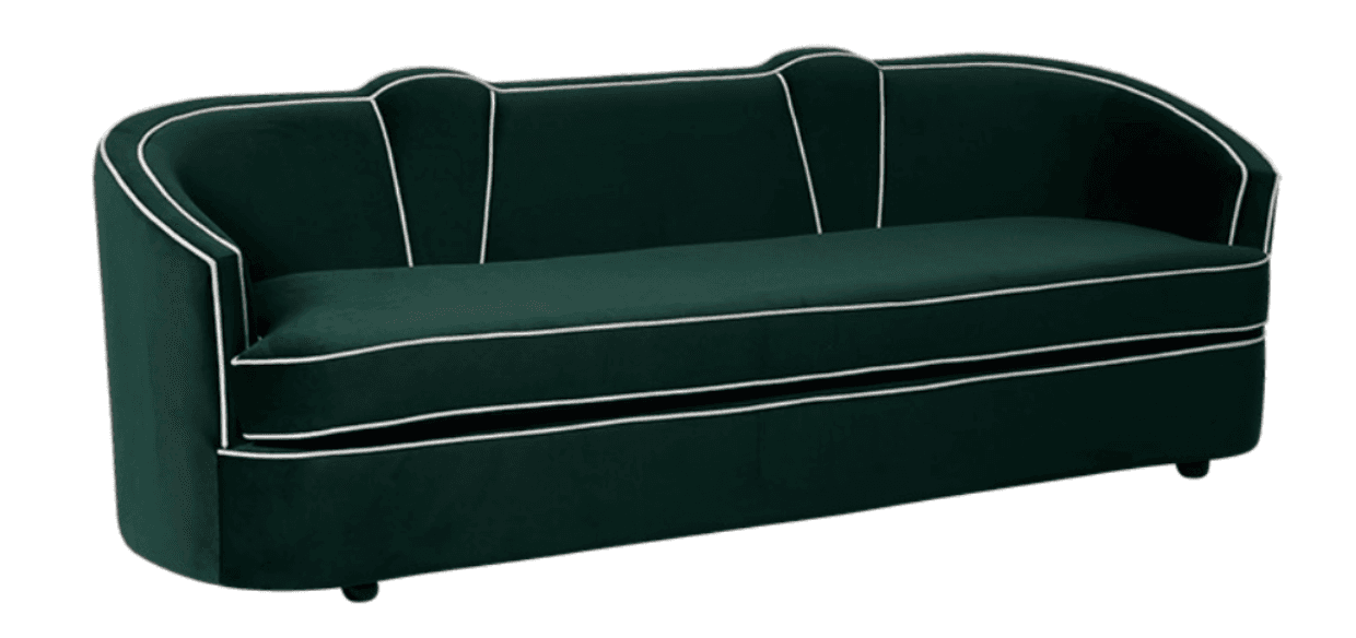 A long, upholstered seating unit with a curved backrest and armrests, covered in deep green velvet fabric. It features prominent white piping along all edges of the backrest, arms, and seat cushion, as well as decorative vertical piping details on the back. The design appears elegant and somewhat retro. — 3D model