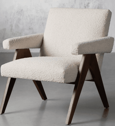 A mid-century modern style lounge chair featuring a light-toned, textured bouclé upholstery and dark-stained angular wooden legs. The chair has wide, flat armrests and a gently reclined backrest, designed for comfort and aesthetic appeal. The exposed wooden frame provides a strong visual structure. — 3D model