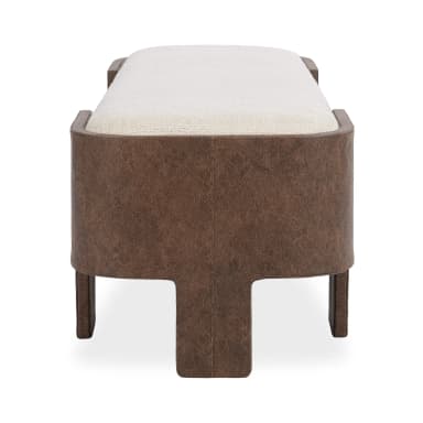 A close-up view of a modern upholstered bench, featuring a rectangular, cushioned top covered in a light, textured cream fabric. The base and integrated legs are constructed from a rich, distressed brown leather or faux leather material, designed with a distinct L-shaped structure at the corners that provides sturdy support and a contemporary aesthetic. — 3D model