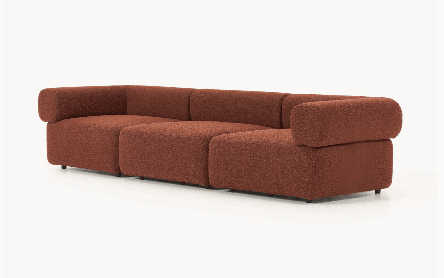 A three-piece modular sectional sofa upholstered in a reddish-brown, textured bouclé fabric. The sofa features a low profile with soft, rounded edges and integrated armrests that curve over the sides. It consists of two end modules with armrests and one armless middle module, allowing for flexible configuration. Small, dark, recessed feet are visible at the base. — 3D model