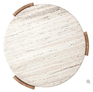 A contemporary round coffee table featuring a substantial marble top with prominent veining and a unique, curved wooden base. The tabletop appears to be made of natural stone, possibly travertine or marble, exhibiting a creamy white base with grey and beige striations. The base is constructed from solid wood, with four curved, quarter-circle-like panels that support the circular top and create an open, airy aesthetic. The wood grain is clearly visible, suggesting a natural finish. The overall design is sculptural and modern, blending natural materials for a sophisticated yet grounded appearance. — 3D model