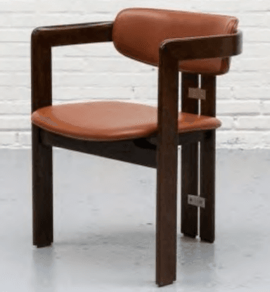 A modern armchair featuring a dark brown wooden frame with integrated armrests and a padded seat and backrest upholstered in cognac-colored faux leather. The chair exhibits clean, rectilinear lines for its frame components, which are visibly joined by metal plates and screws on the exterior of the rear legs. The backrest has a gentle curve at the top, and all wooden edges appear to be subtly rounded. The upholstery is smooth and unadorned. — 3D model