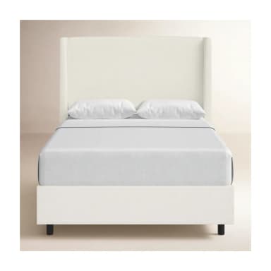 A white upholstered bed frame with a tall, winged headboard. The bed is dressed in white linens, including a duvet and pillows. Dimensions are provided: 55 inches in height for the headboard, 85 inches in length, and 65 inches in width. The frame itself appears to be a platform style with a low profile, indicated by the 4-inch measurement. The legs are black and barely visible. — 3D model
