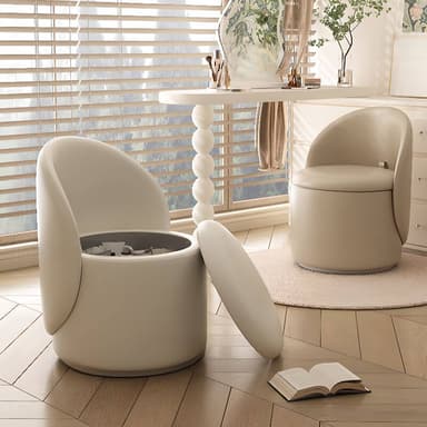 A compact, beige-upholstered, cylindrical furniture piece designed for seating and storage. It features a low, rounded backrest that extends from the main body. The top is a removable, padded lid, revealing a dark-colored storage compartment within the main cylindrical structure. — 3D model