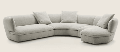 A sectional sofa with a curved, semi-circular configuration. It features multiple seating sections and includes four throw pillows. The overall design is modern and minimalist, with soft, rounded edges and a plush upholstery. — 3D model