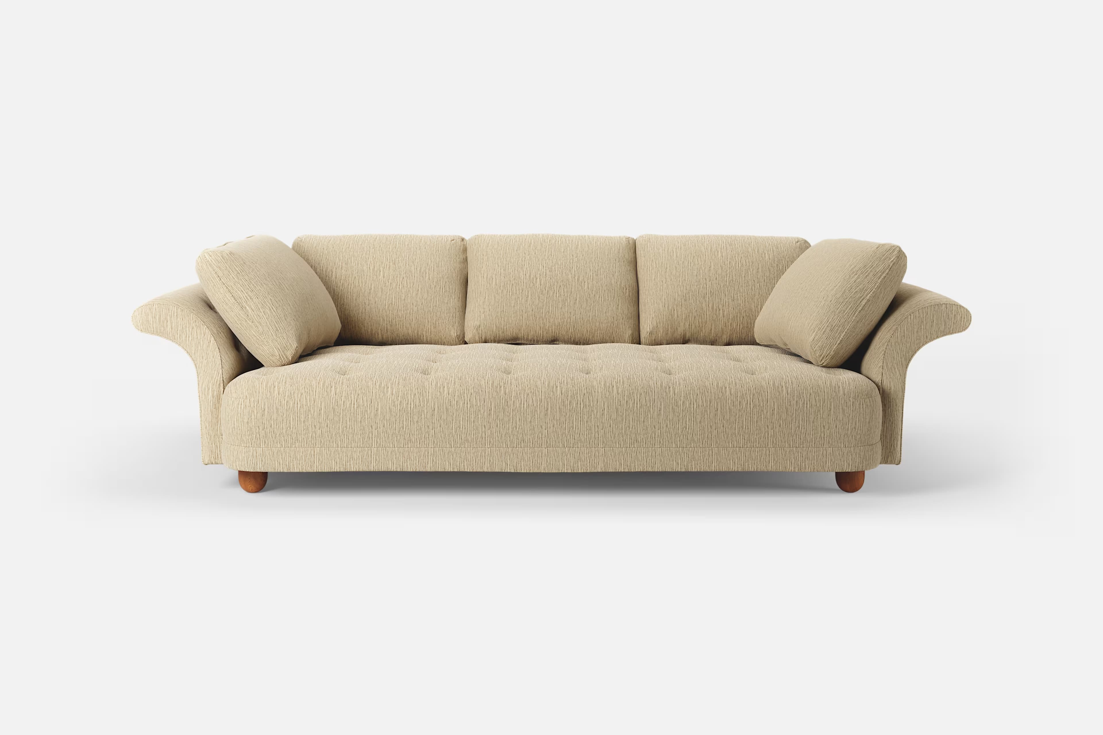 A three-seater sofa with a textured fabric upholstery. It features three back cushions and two plush armrest cushions. The base of the sofa is supported by four rounded wooden legs. The front upholstery of the seat cushion shows subtle button tufting. — 3D model