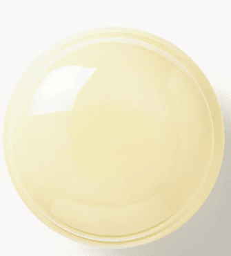 A wall-mounted lighting fixture featuring two concentric, overlapping, dome-shaped diffusers made of opaque, creamy white glass, set against a circular brass base. The overall form is organic and sculptural. — 3D model