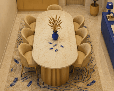 A modern coffee table with an oval-shaped top and two cylindrical bases. The tabletop has a marble-like pattern in beige and light brown. The bases are fluted, resembling vertical wooden dowels or tubes, and have a matte beige finish. — 3D model