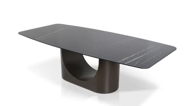 A modern dining table with a rectangular, subtly rounded tabletop and a sculptural, single pedestal base. The tabletop has a marble-like pattern with grey and white veining. The base is a dark, matte, curved structure that appears to be U-shaped when viewed from the side. — 3D model