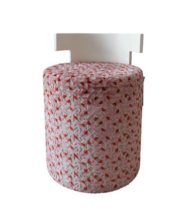 A contemporary cylindrical stool featuring a pink and red geometric patterned upholstery and a distinctive T-shaped white backrest. The base is fully upholstered with a textured fabric, while the backrest provides a clean, minimalist contrast in a solid color. — 3D model