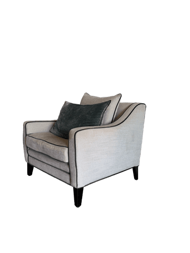 A contemporary upholstered armchair featuring a light, textured fabric and dark contrasting piping. It has a deep seat, padded armrests, and comes with a matching back pillow and a dark green velvet throw pillow. The chair is supported by dark, low-profile tapered legs. — 3D model