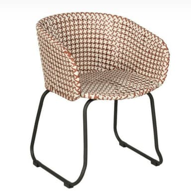 A modern armchair with a distinctive woven seat and back. The frame is constructed from dark metal, providing a sturdy base. The woven pattern features a repeating geometric design in alternating brown and white colors, creating a visually appealing texture. — 3D model