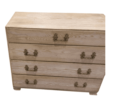 A four-drawer chest of drawers made from bleached oak wood, featuring ornate brass pull handles and a light, natural wood finish. — 3D model