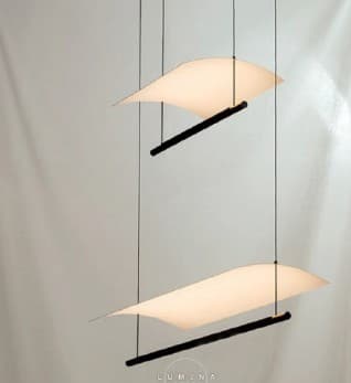 A set of two contemporary pendant lights, each featuring a horizontally oriented black linear bar housing an integrated light source, positioned beneath a gently curved, thin white diffusing panel. Both elements are suspended by delicate, almost invisible wires from an unseen ceiling mount, creating a sense of lightness and sculptural form. The design is sleek and minimalist, focusing on indirect and diffused illumination. — 3D model