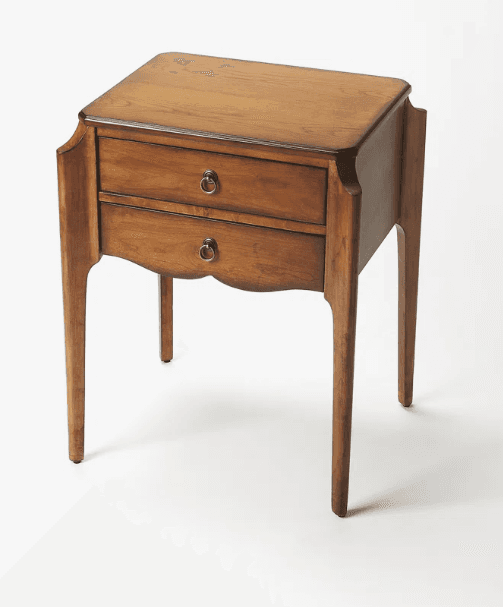 A wooden nightstand with a rectangular top and two drawers. The drawers have brass ring pulls. The piece features curved legs and decorative side panels. — 3D model