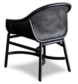 A contemporary black accent chair featuring a woven cane back and seat, supported by a sleek tubular black frame. — 3D model
