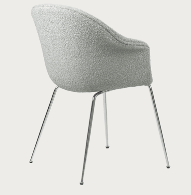 A modern upholstered chair with integrated armrests and slender chrome legs, viewed from a rear-side angle against a plain background. — 3D model