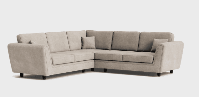 A contemporary L-shaped sectional sofa, upholstered in a light beige textured fabric. It features multiple seat cushions and back cushions, with two additional throw pillows. The sofa is supported by short, dark-colored, tapered legs. — 3D model