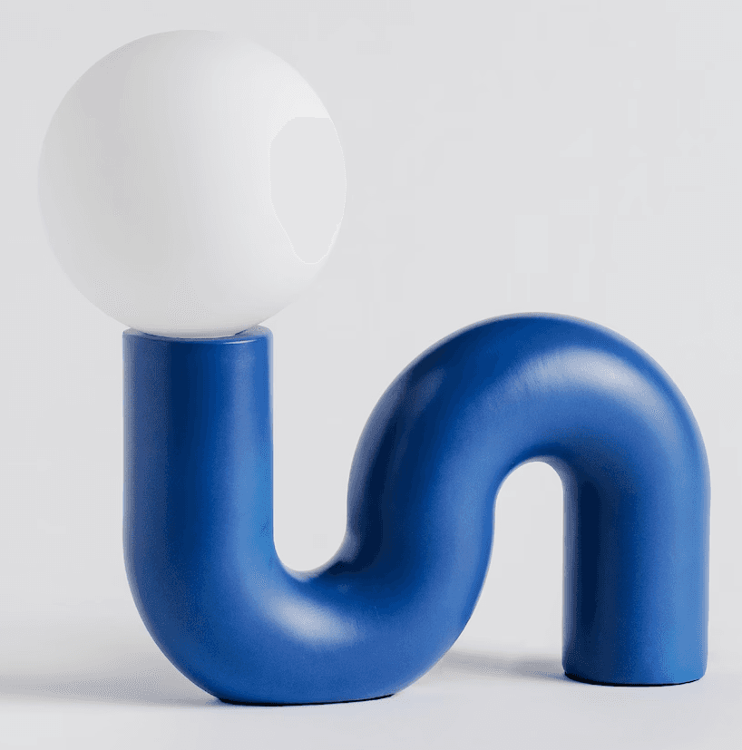 A modern table lamp with a sinuous, tubular base in a gradient blue finish, supporting a spherical white diffuser at its upper curve. — 3D model