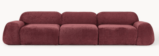A modular sofa with a plush, textured upholstery. The sofa consists of multiple distinct sections that can be arranged in various configurations. Each section has a rounded, continuous form, suggesting a soft and inviting design. The armrests and backrests are integrated into the overall structure with soft, curved edges, and the seat cushions are plump and well-defined. — 3D model