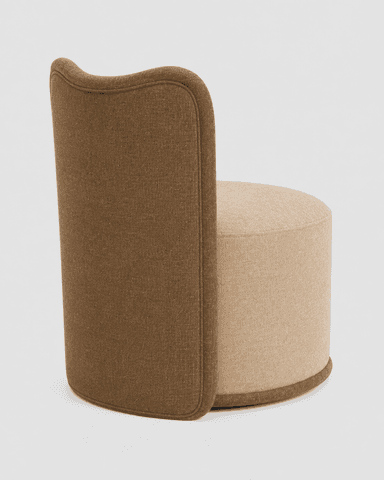 An upholstered armless accent chair featuring a cylindrical base and a low, curved backrest, all covered in a light beige fabric with a contrasting dark brown trim along the edges. — 3D model
