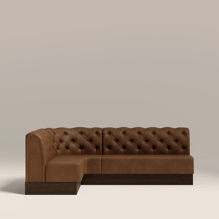 A tufted L-shaped sectional sofa with a low-profile base. The sofa features deep diamond tufting on the backrests and seat, upholstered in a smooth, brown material. The base is a dark, wood-grained plinth. — 3D model