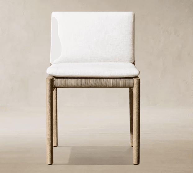 An armless dining chair featuring a light-toned solid wood frame, a seat base crafted from tightly woven natural fiber (appearing as rope or rattan), and removable upholstered cushions for both the seat and backrest in a white or off-white fabric. — 3D model