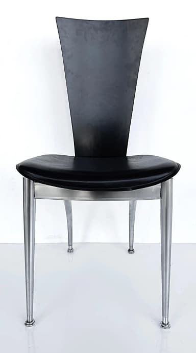 A modern chair featuring a black, curved backrest and a black, cushioned seat. The frame and four tapered legs are constructed from brushed metal, offering a sleek, contemporary aesthetic. The seat appears to be upholstered, possibly in leather or a similar synthetic material, and is supported by a silver-toned metal frame that extends to the legs. — 3D model