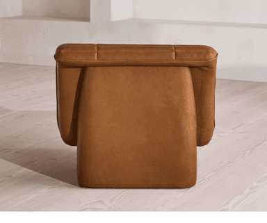 A single-seater armchair upholstered in brown leather with a tufted and channel-stitched design. The chair features a low-profile, boxy base and integrated armrests that flow into the seat and backrest. The upholstery exhibits consistent stitching and button tufting on the backrest and seat cushion. — 3D model