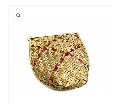 A traditional handwoven bamboo winnowing basket, characterized by its shallow, scoop-like form with a flat base and raised, curved edges. The weave features a distinct herringbone pattern created by alternating lighter and slightly darker bamboo strips, suggesting different natural shades or processing. The rim is reinforced with thicker bamboo strips, and the corners or handles are secured with wrapped twine. — 3D model